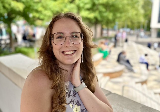 Katie Spencer smiles to the camera