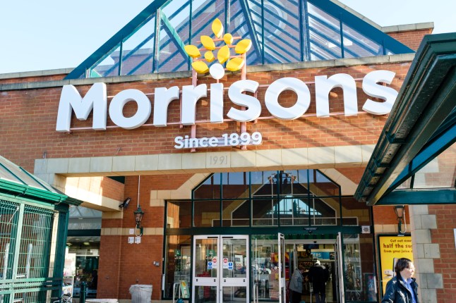 The exterior of a Morrisons supermarket, with its large white and yellow logo.