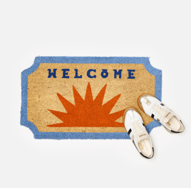Welcome Orange Sunset Doormat from Oliver Bonas