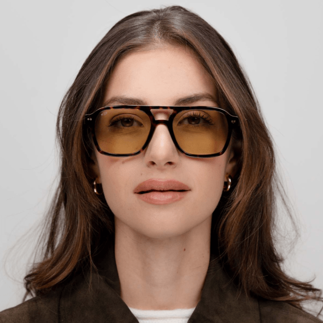 Model wears Zurich Edge Dark Tortoise Green by Kapten & Sons