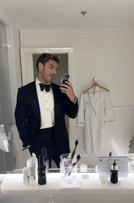 Chris Appleton posing in the bathroom with Three Warriors Tan Mist on show