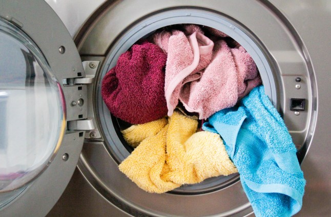 Colourful towels in a washing machine