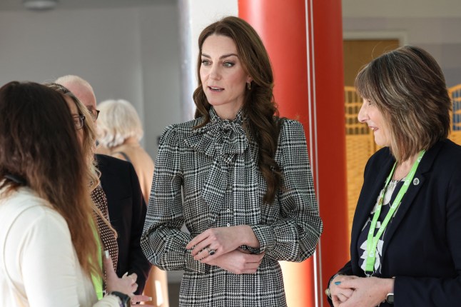 Britain's Catherine, Princess of Wales speaks with staff during a visit Ty Hafan, a children's hospice based in Sully, near Cardiff, which supports families in Wales, on January 30, 2025. (Photo by Richard Pohle / POOL / AFP) (Photo by RICHARD POHLE/POOL/AFP via Getty Images)