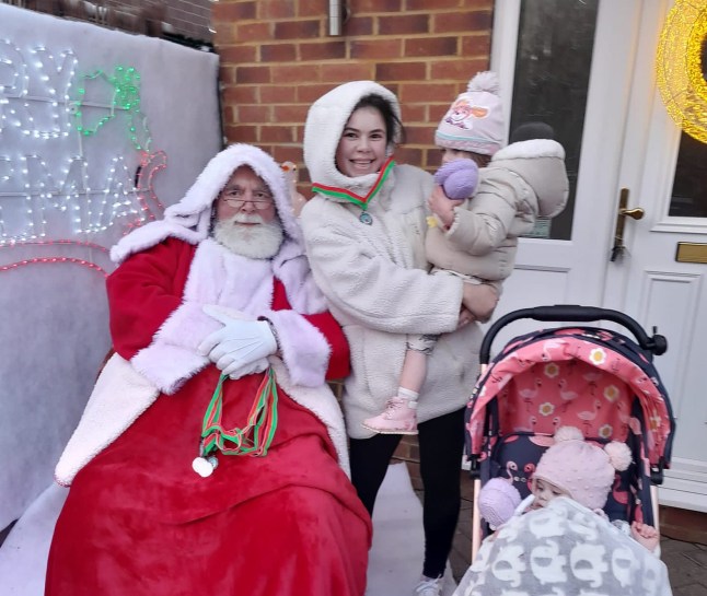 Milly Hadden and her two childern with Santa Claus