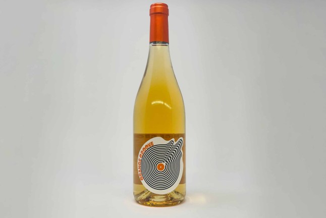 Orange Groove wine on a grey background