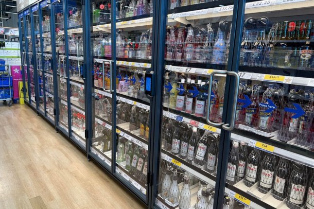 Supermarket shoppers have been left puzzled as a new system makes it harder to access a certain product. Within Tesco stores across Wales alcohol is now being kept behind a set of doors as a new security system is put in place. Throughout the supermarket's stores, new security measures have been put in place over the years with the makeup cabinets being locked up in the evening, security tags on products over ?10 and wire netting on bottles. But now a new system has been implemented to make shoplifting even harder. New glass doors have been installed encasing the alcohol in some Tesco stores around Wales for increased safety against shoplifters.