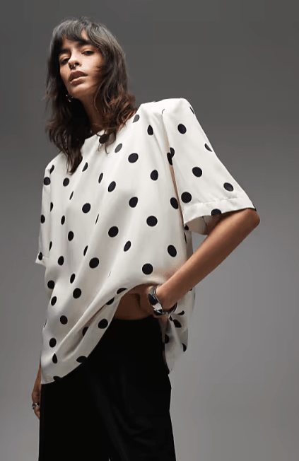 Female wears polkadot ASOS top