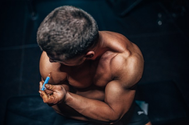 Man injecting steroids