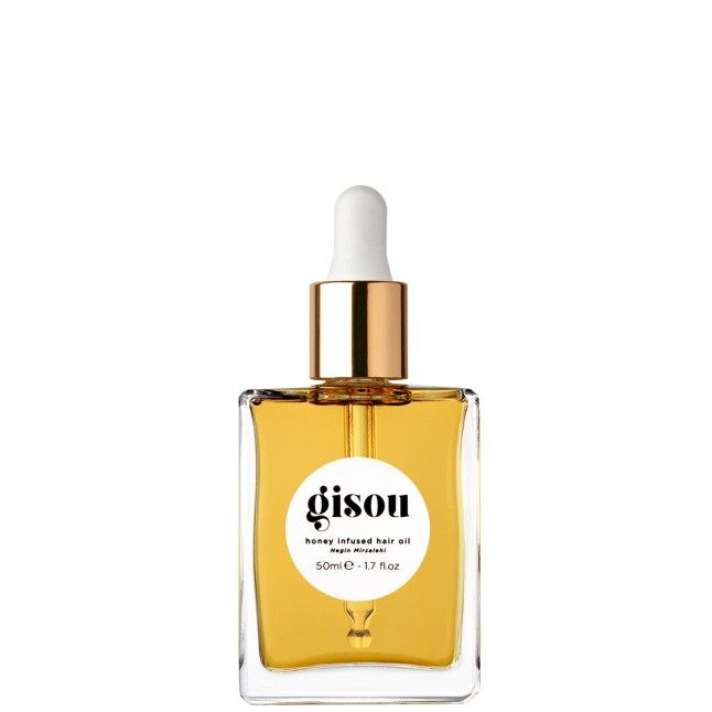 Bottle of Gisou Honey Infused Hair Oil with white cap