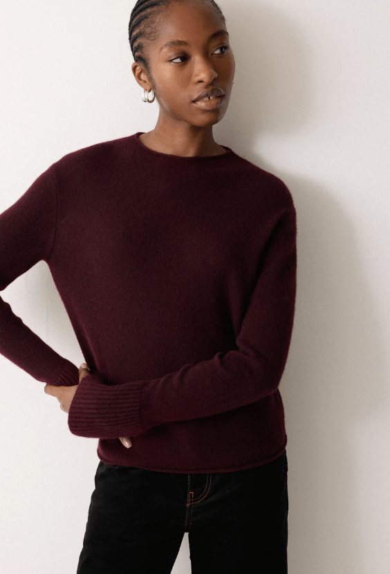 Female wears brown jumper