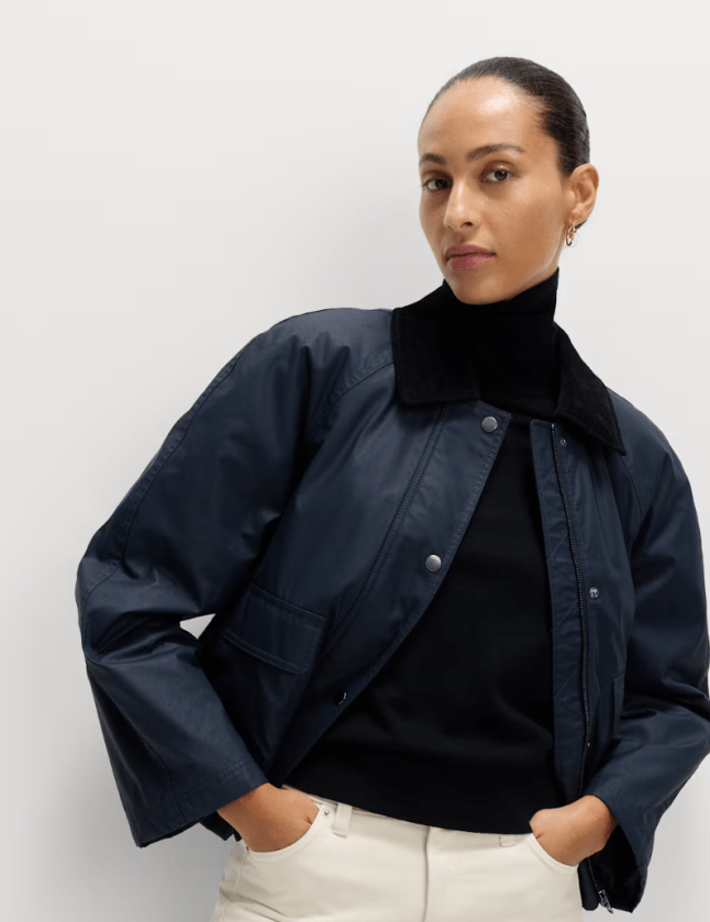 Female wears navy M&S wax jacket
