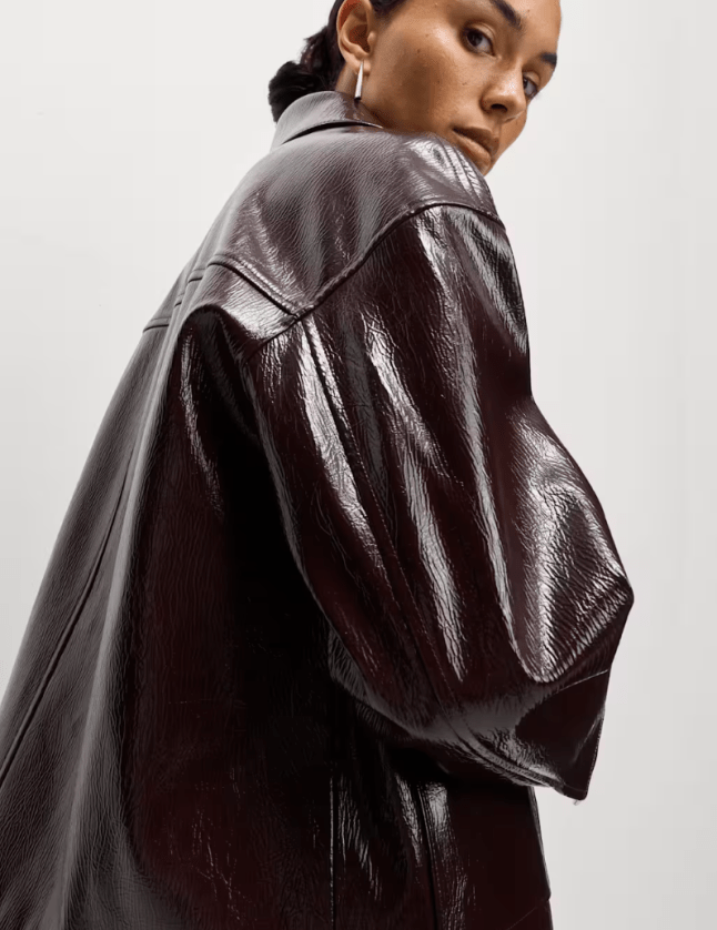 Female wears burgundy M&S jacket