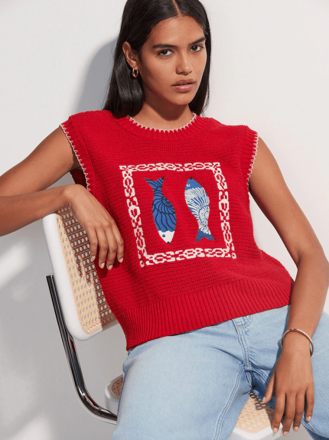 Female wears red Next fish printed knit
