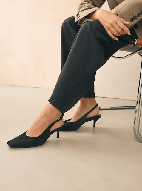 Female wears black heels and tightly fitting Next shoes