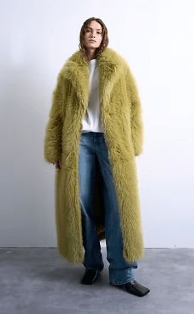 Female wears oversized green TOPSHOP jacket mae from faux fur