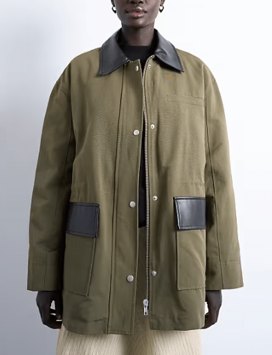 Female wears dark green TOPSHOP jacket with leather trim