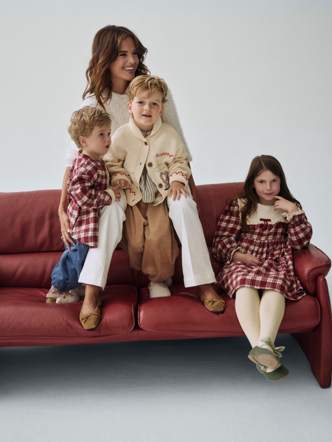 Female posing eith three small children