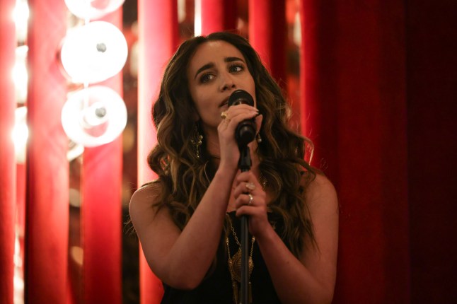 Singer Chloe Stroll with a microphone