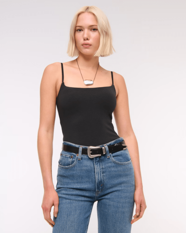 Female wears black Bra-Free 90s Cami Bodysuit from Abercrombie