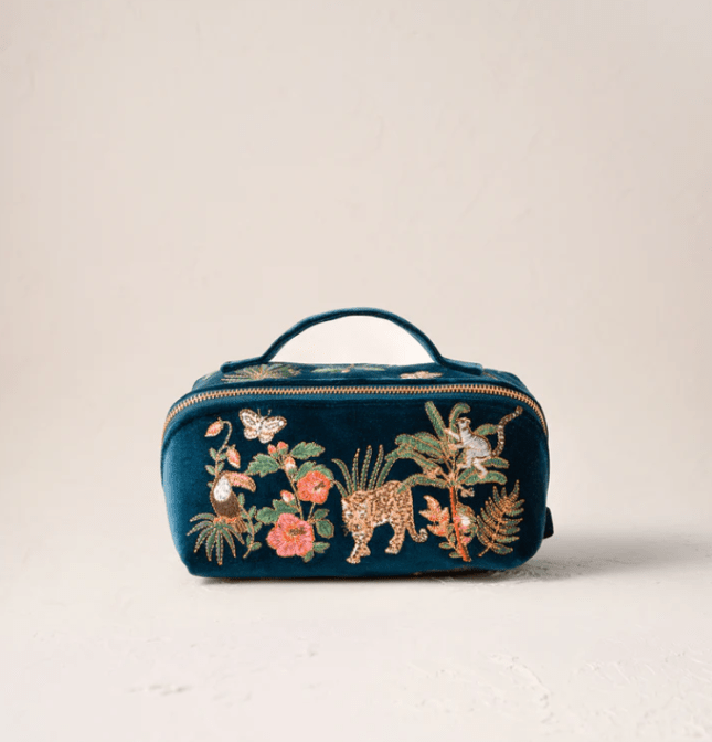 Blue makeup bag with animals stitched on the front