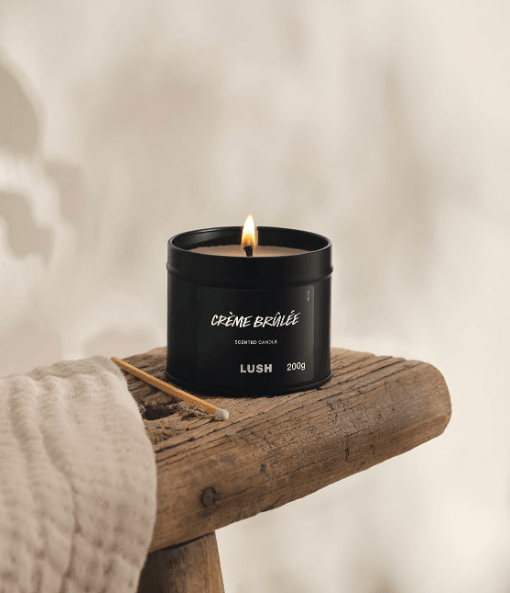 Lush Crème Brûlée Single Wick Candle on a wooden surface