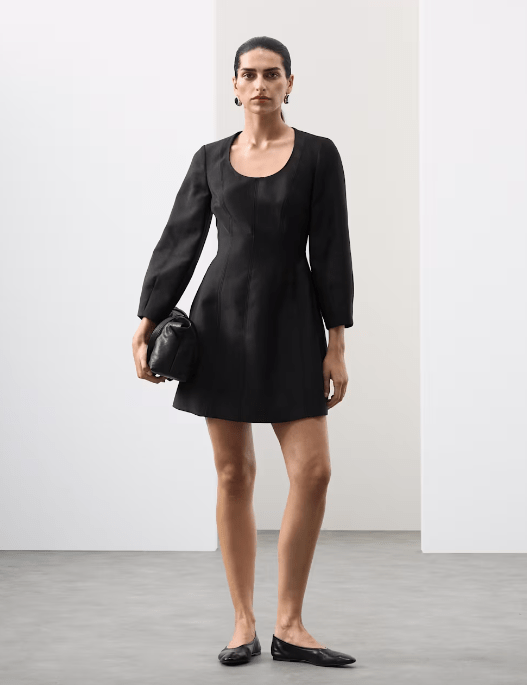 Female wears M&S Scoop Neck Mini Waisted Dress