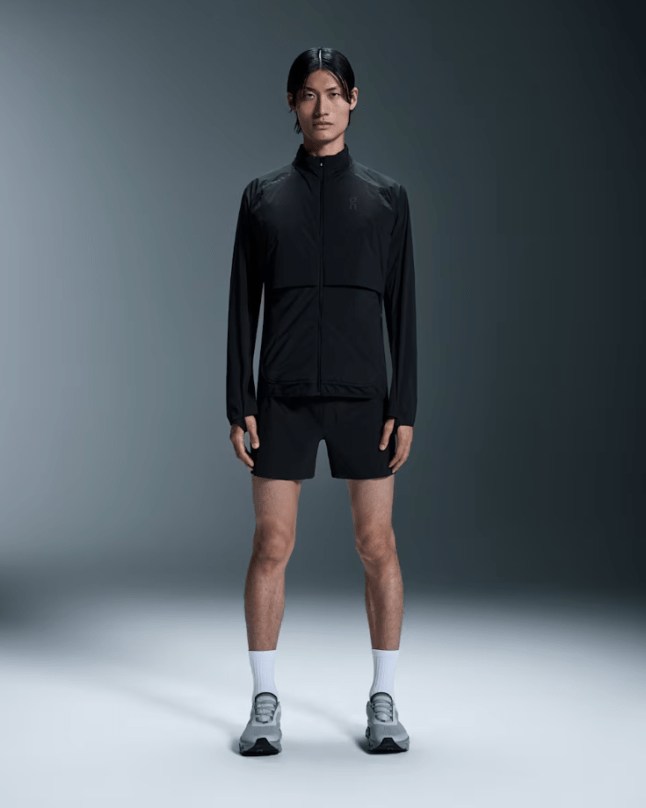 Male wears black On Running Weather Jacket Insulated