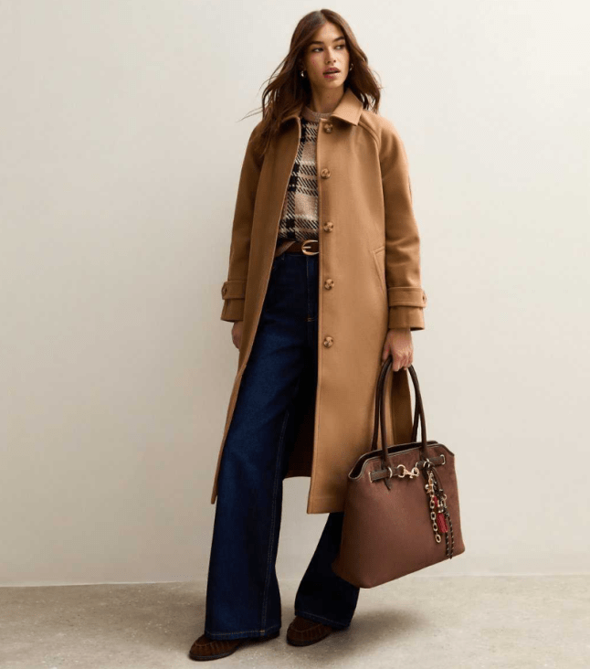 Female wears caramel New Look coat
