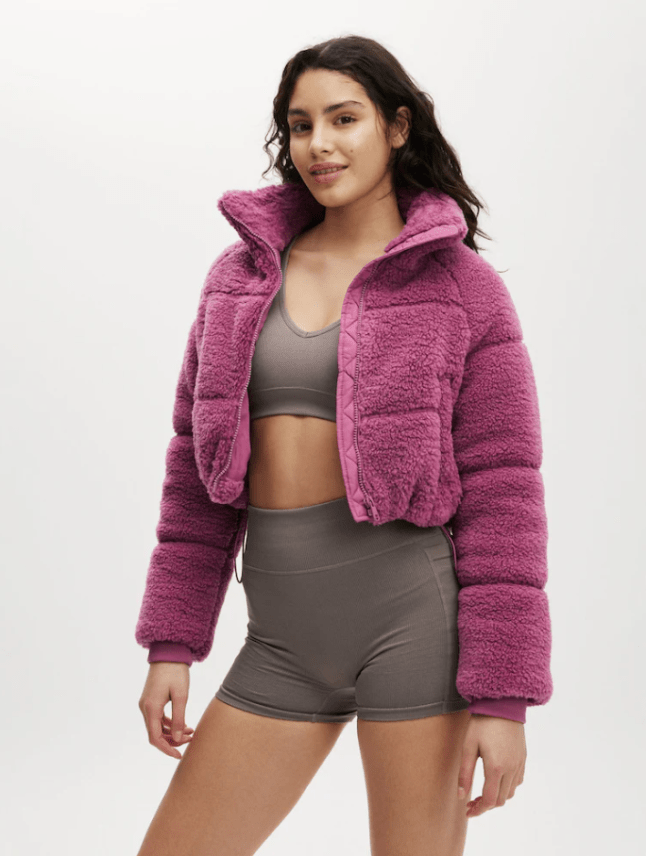 Female wears purple Next Cotton On Pink The Mother Puffer Cropped Sherpa Jacket
