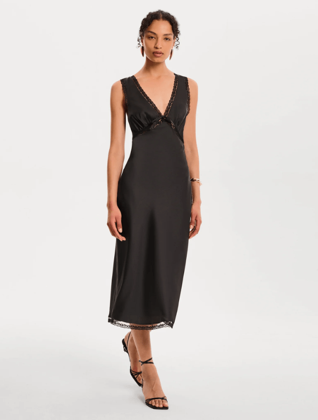 Female wears black v-neck dress
