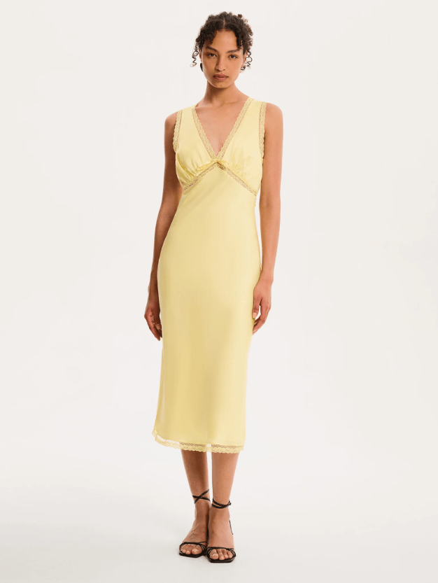 Female wears butter yellow v-neck dress