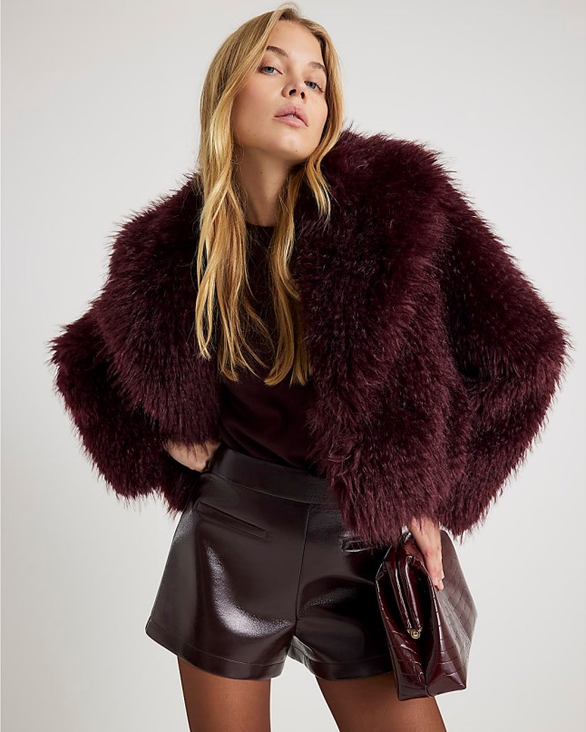 Female wears River Island Red Faux Fur Coat