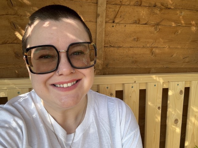 Emma Flint wears sunglasses while smiling