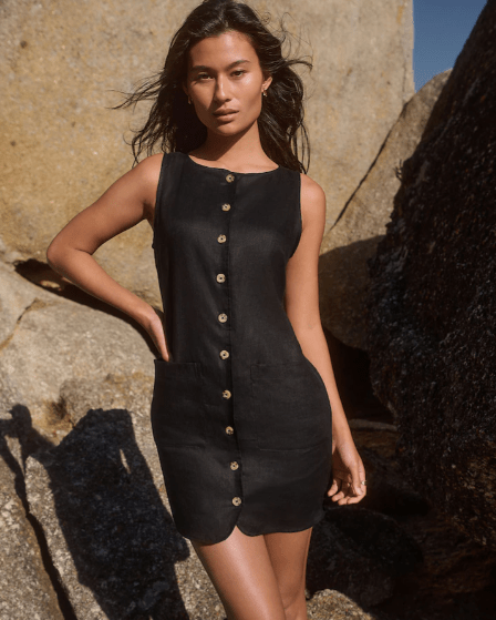 Female wears black linen Next dress