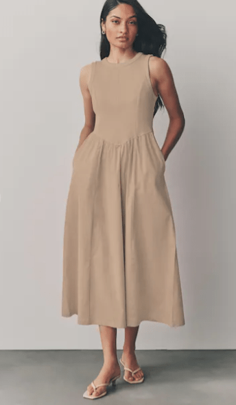 Female wears beige Next dress