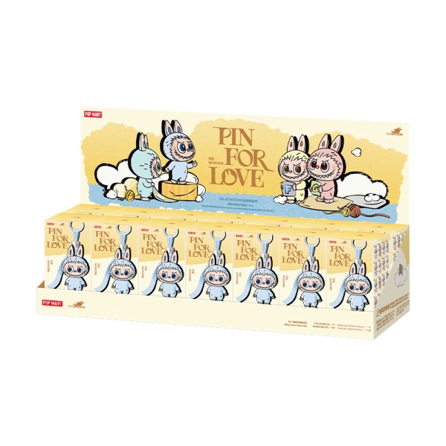 Mini Labubu key chains in yellow boxes