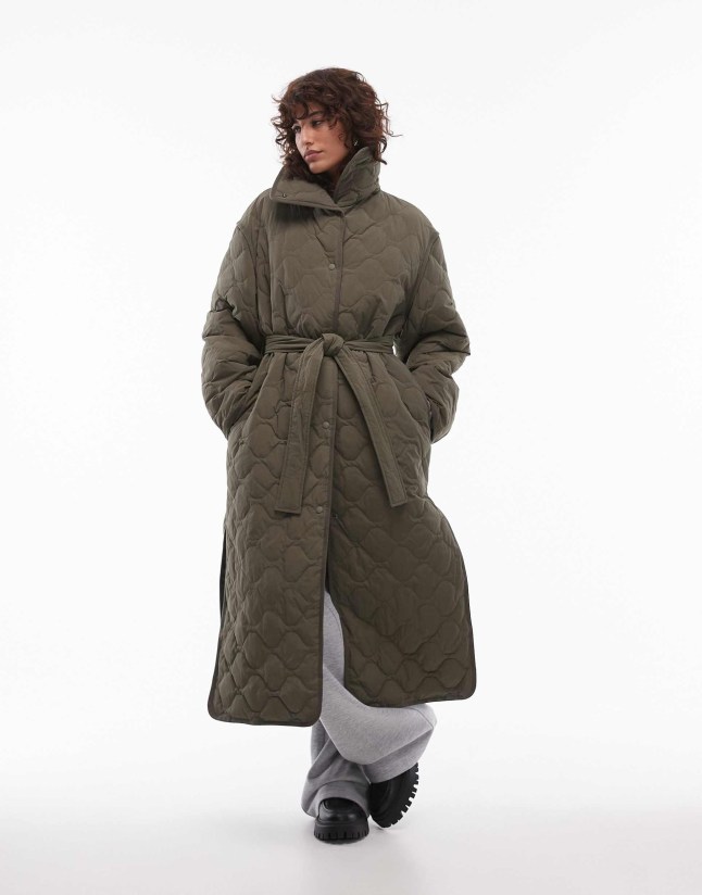 Female wears ARKET coat
