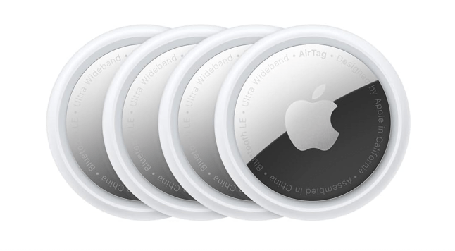 Four silver, round tags stacked together