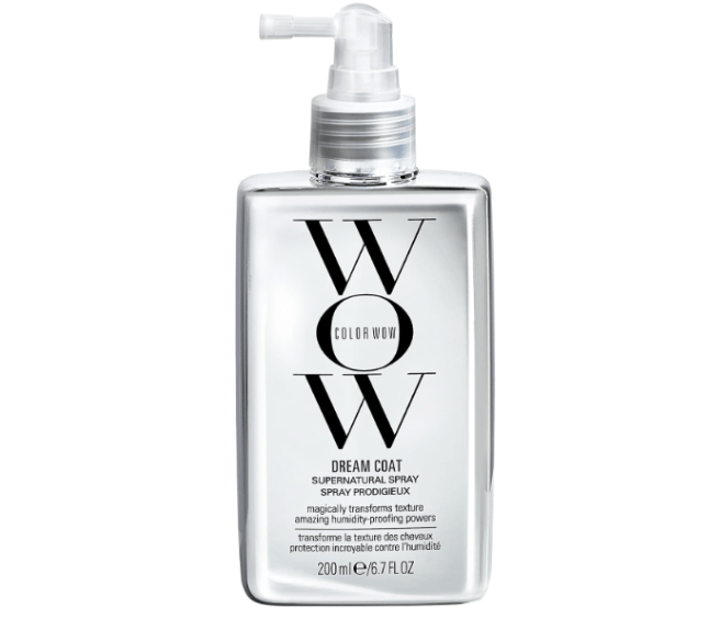 Silver spray bottle with black writing on the front