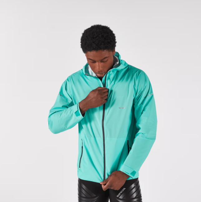 Male wears green KIPRUN Run 900 Men's Waterproof, Breathable Running Jacket