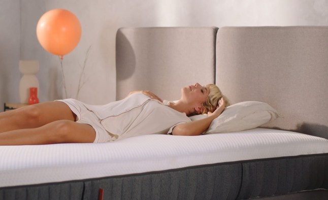 Woman sleeps on a mattress from Emma Sleep