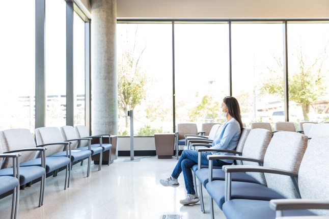 Adult female sits in the waiting room