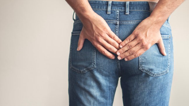 Person with hemorrhoids and constipation