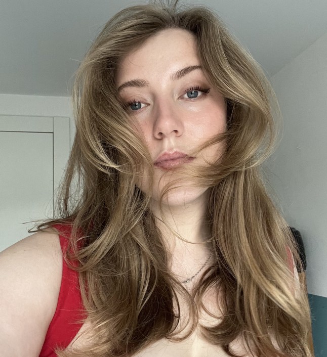 Lydia Wheatley showing her hair after being styled with the ghd Duet.