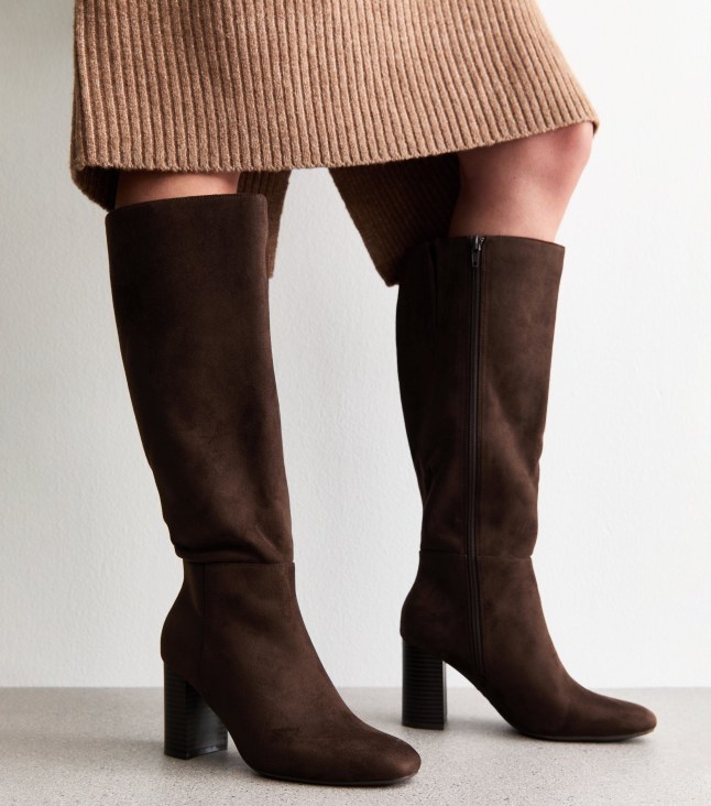 Female wears New Look boots