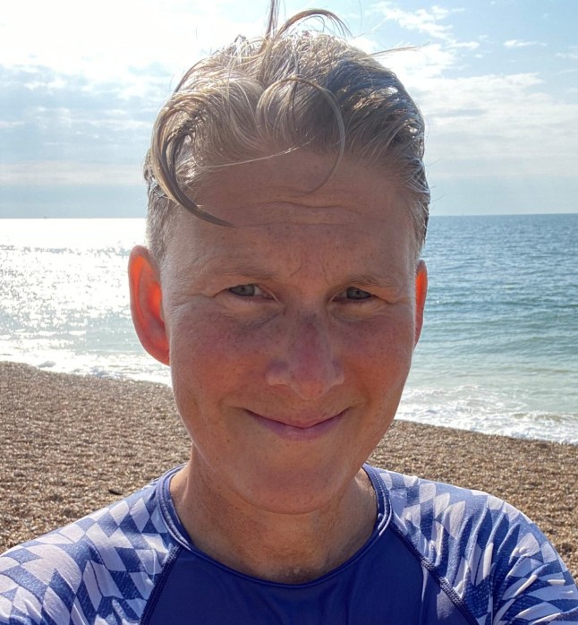 Kit takes a selfie in front of the sea