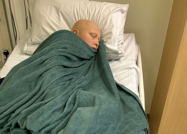 Tyler Scott, in hospital. // A teen was diagnosed with stage four cancer after doctors initially thought he had tonsilitis. Tyler Scott, 13, has gone from competing in cheerleading events in the US to undergoing intense chemotherapy which leaves him 'lifeless'. Mum Charley Hemming, 33, suspected something was wrong after she started spotting lumps on her son's neck in the summer of 2024. Now the family of six from Gosport in Hampshire have had their lives 'turned upside down' as brave Tyler battles Hodgkin Lymphoma. Photo released 28/10/2025