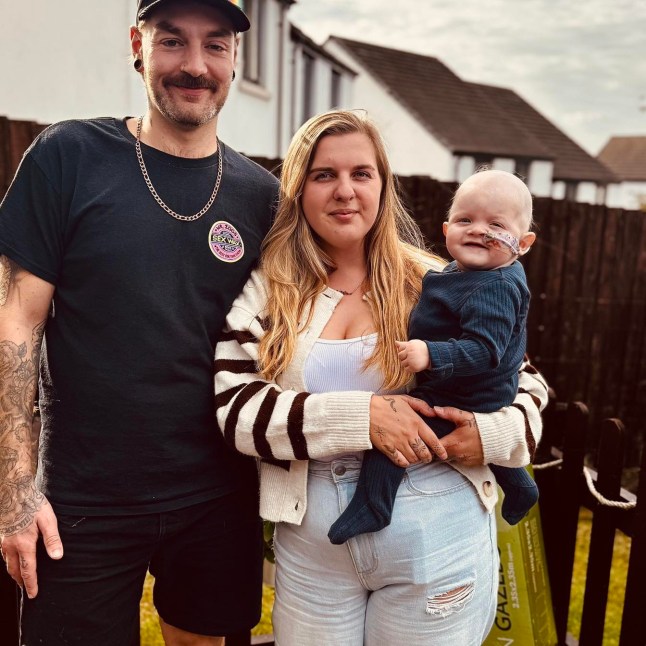 Baby Otto with parents, Sophie Reddaway, 25, and dad Paul Acreman, 27. // A one-year-old baby was diagnosed with a rare form of cancer after doctors initially thought his breathing problems were a cold. Otto Acreman's smitten parents are living a 'nightmare' after a spot at a family barbecue led to the devastating stage four diagnosis. Mum Sophie Reddaway, 25, and dad Paul Acreman, 27, were over the moon when they welcomed their first child was born in September 2024. Weighing seven lbs and three ounces, 'beautiful' Otto's birth was 'the best time' in the couple from Okehampton, Devon's lives. Photo released 29/10/2025