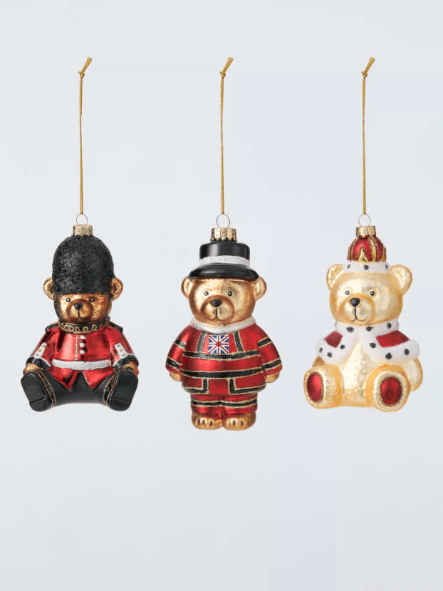 Three bears in London-themed outfits