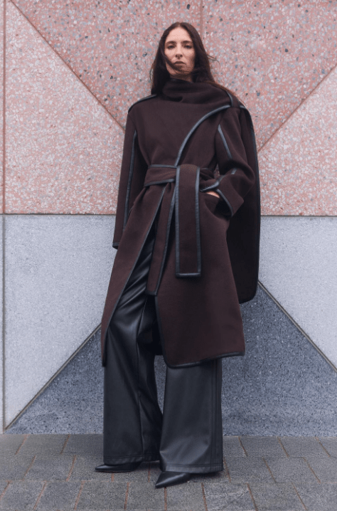 Female wears belted coat from Karen Millen